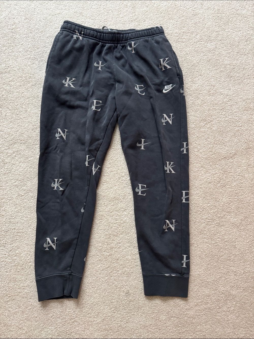Nike Men’s Black Allover Letter Print Joggers